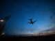 plan flying at dusk
