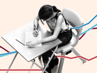 A schoolgirl works at a desk