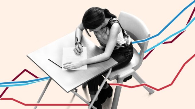 A schoolgirl works at a desk